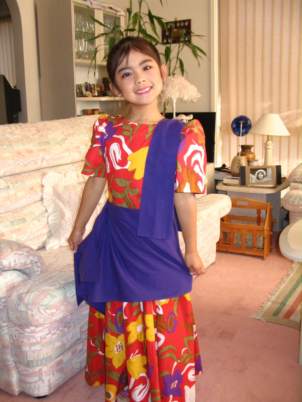 Rachel as a child wearing traditional Filipino clothing.
